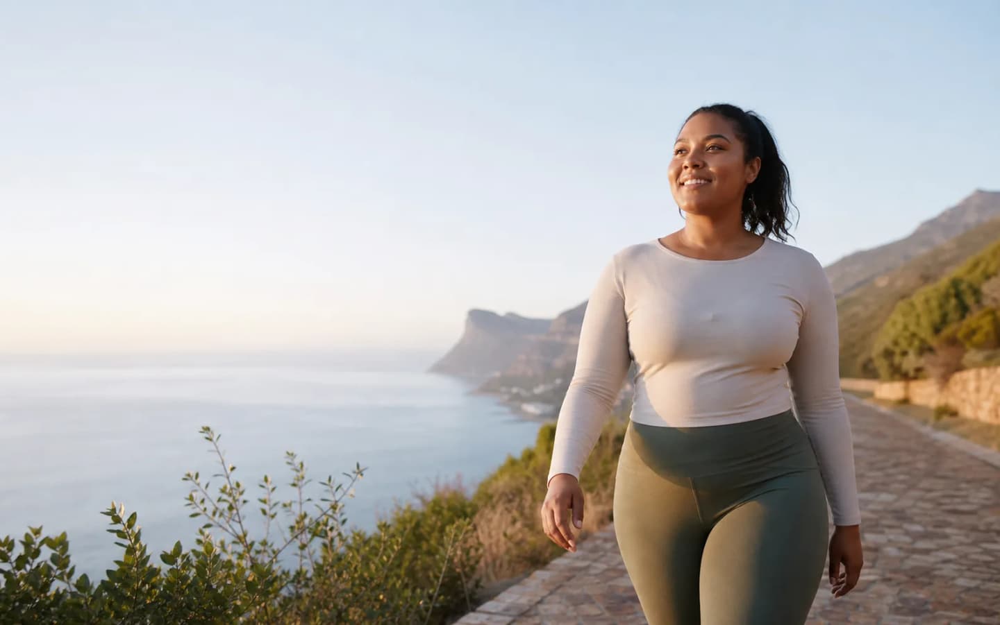 South African woman walking outdoors as part of a supported health routine